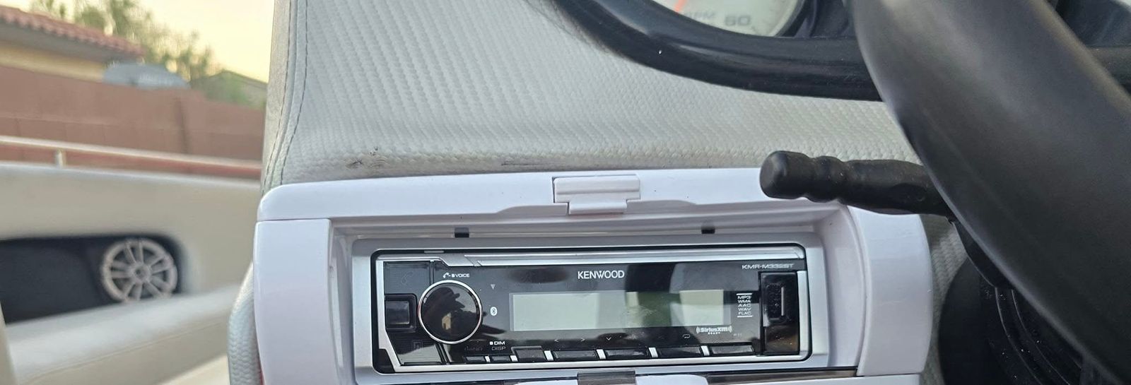 Kenwood marine receiver in ski boat helm