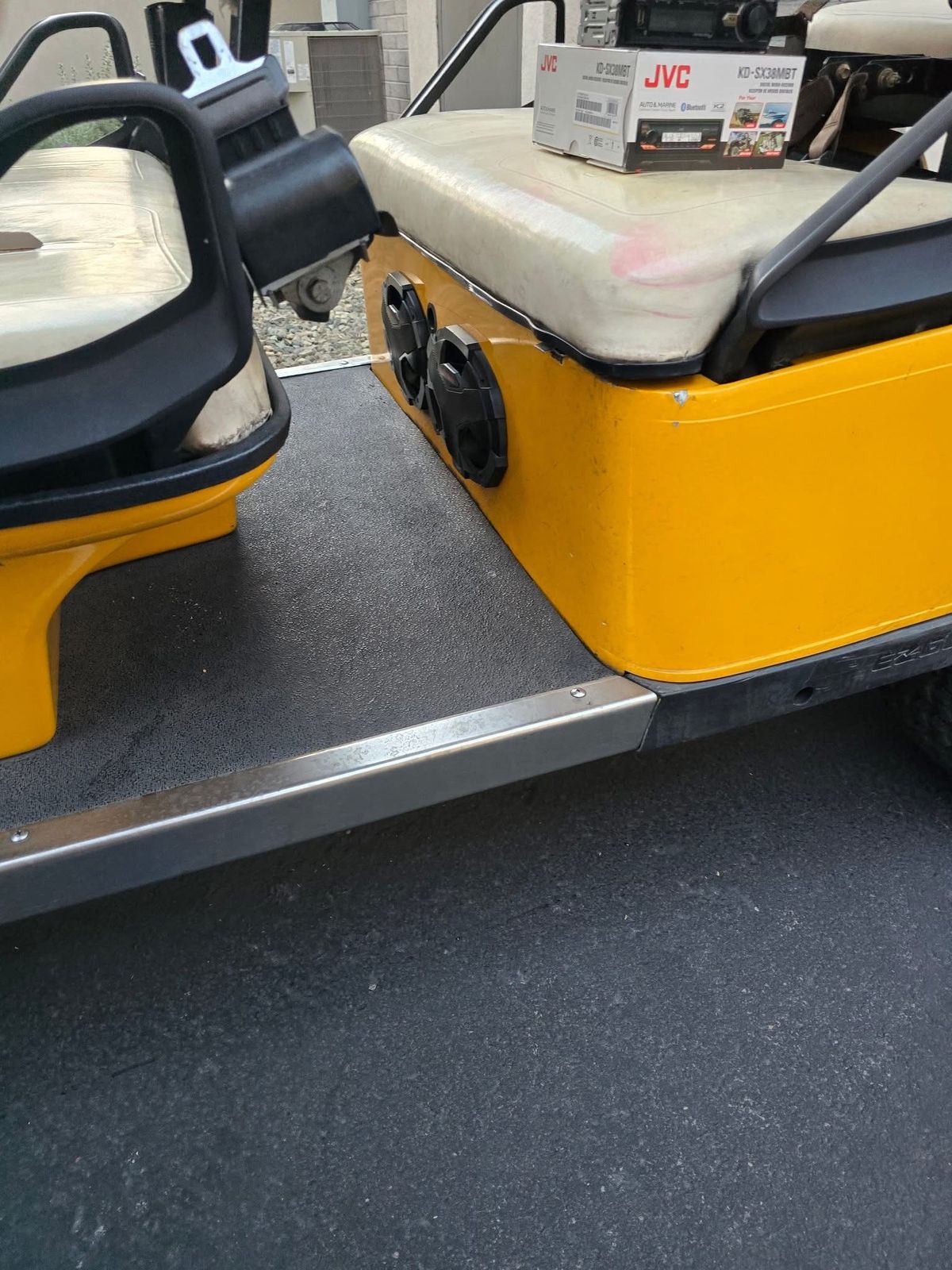 Speakers mounted in golf cart seat box